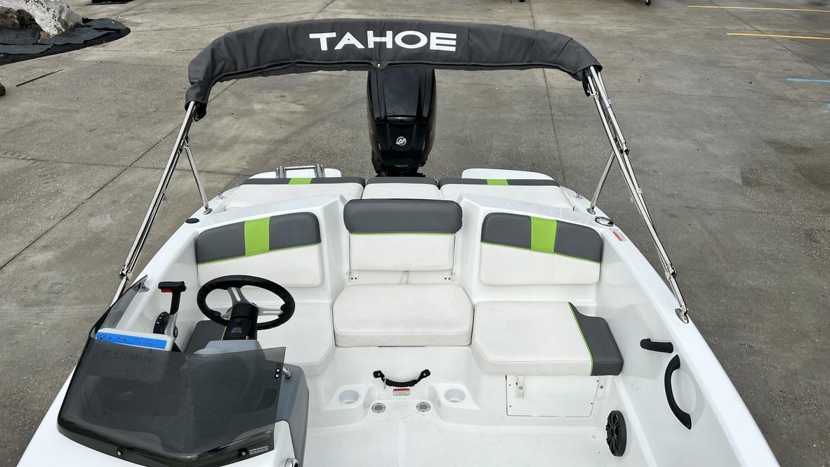 Slide: The Image of 2021 Tahoe T16 boat interior with seating and steering wheel. - 19
