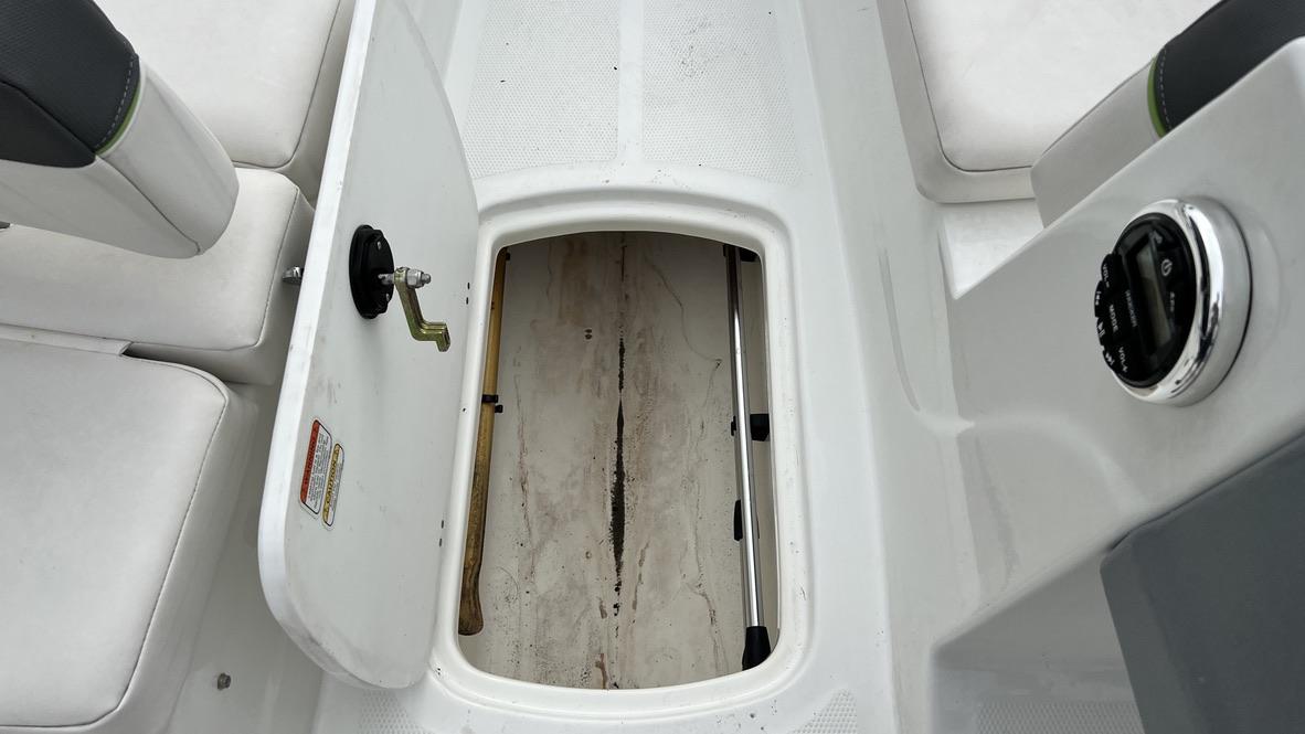 Slide: The Image of Open storage compartment on a 2021 Tahoe T16 boat. - 5
