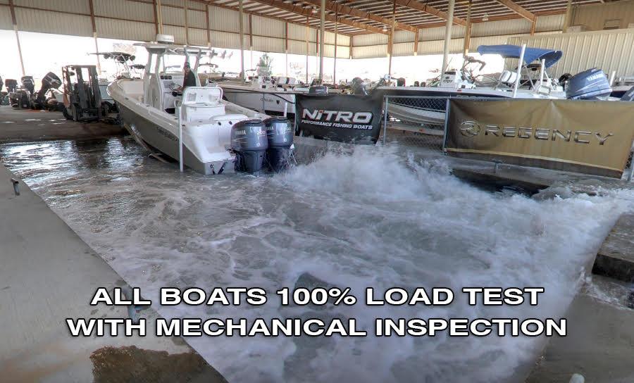 Slide: The Image of 2021 Tahoe T16 boat undergoing 100% load test with mechanical inspection in a covered facility. - 6