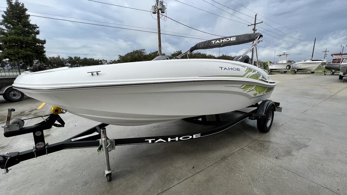 Slide: The Image of 2021 Tahoe T16 boat on trailer in outdoor lot. - 8