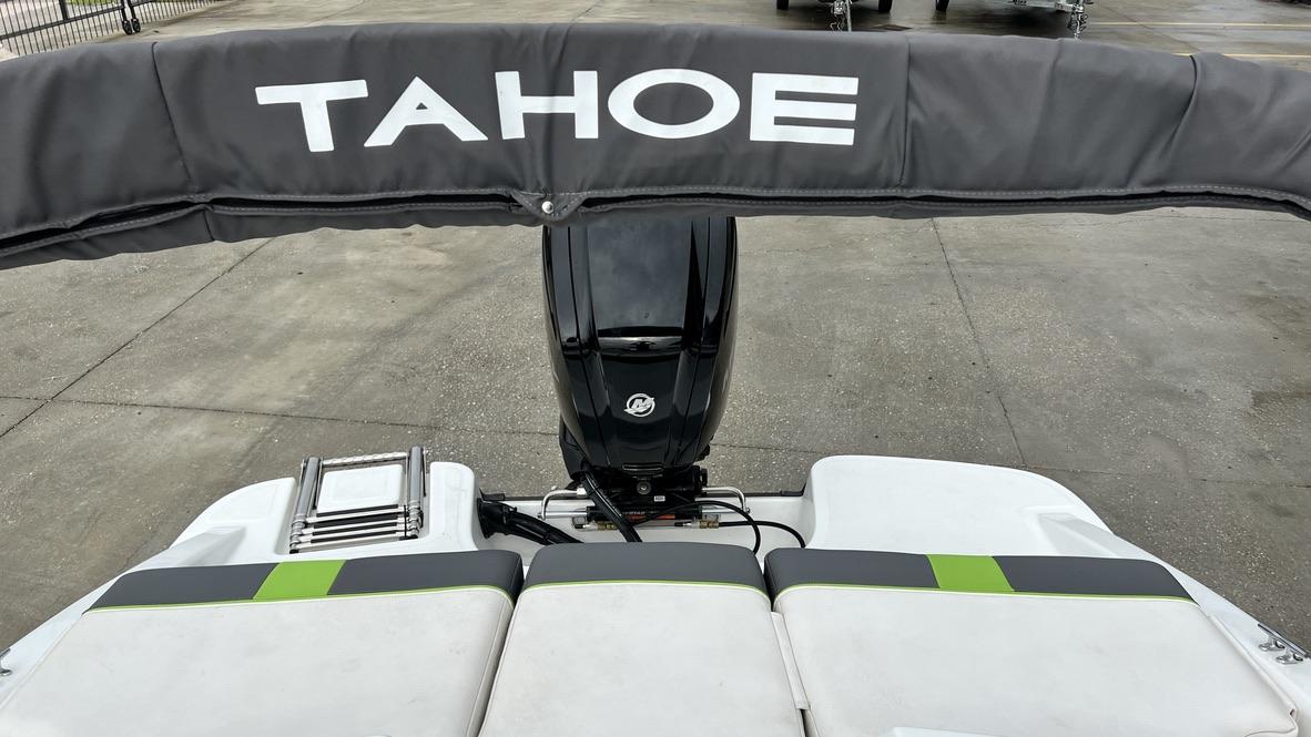 Slide: The Image of 2021 Tahoe T16 boat with outboard motor and cushioned seating. - 9