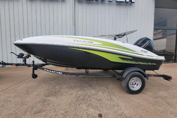 Slide: The Image of 2024 Tahoe T16 boat on trailer, white and green design, side view. - 0