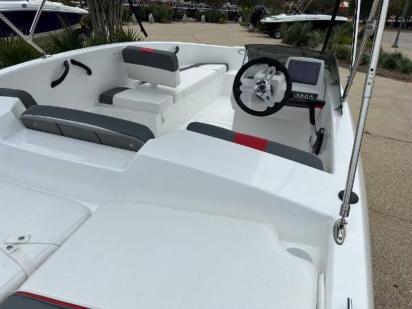 Slide: The Image of 2024 Tahoe T16 boat interior with steering wheel and seating. - 1