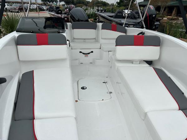 Slide: The Image of 2024 Tahoe T16 boat interior with white and gray seating, red accents, and storage compartments. - 4
