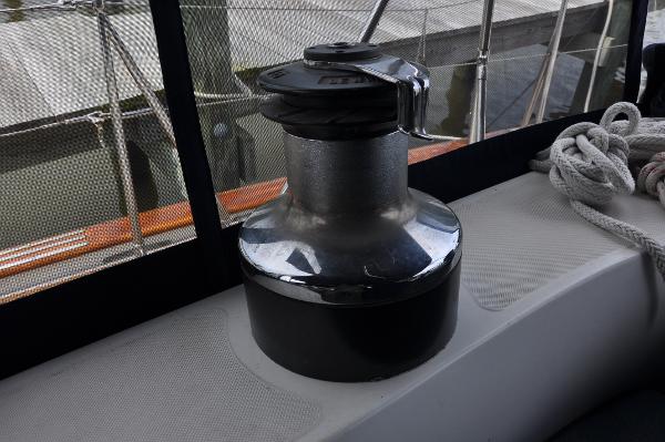 Slide: The Image of Winch on 1988 Tayana 52 sailboat deck with ropes and netting. - 16