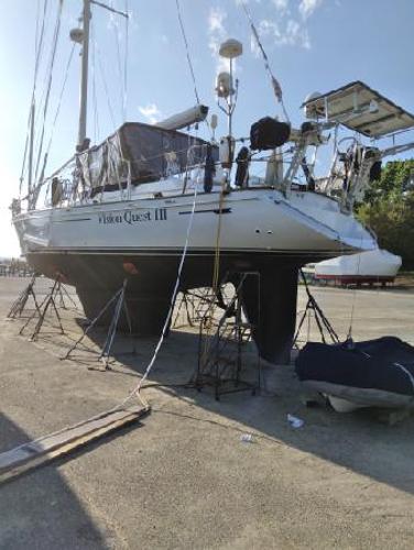 Slide: The Image of 1988 Tayana 52 sailboat Vision Quest III on dry dock for maintenance. - 18