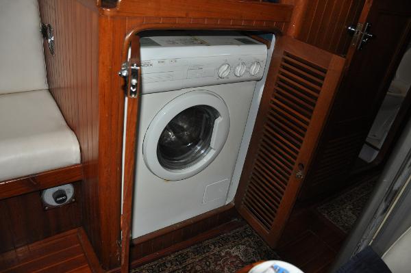 Slide: The Image of Washing machine in the wooden interior of a 1988 Tayana 52 yacht. - 34