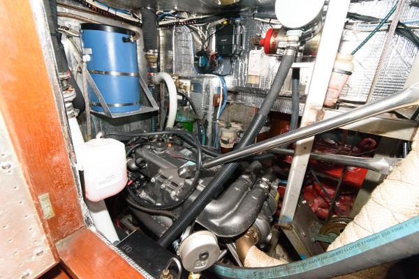 Slide: The Image of Engine room of a 1988 Tayana 52 sailboat with various mechanical components. - 35