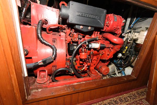 Slide: The Image of Engine compartment of a 1988 Tayana 52 sailboat with a Westerbeke engine. - 36