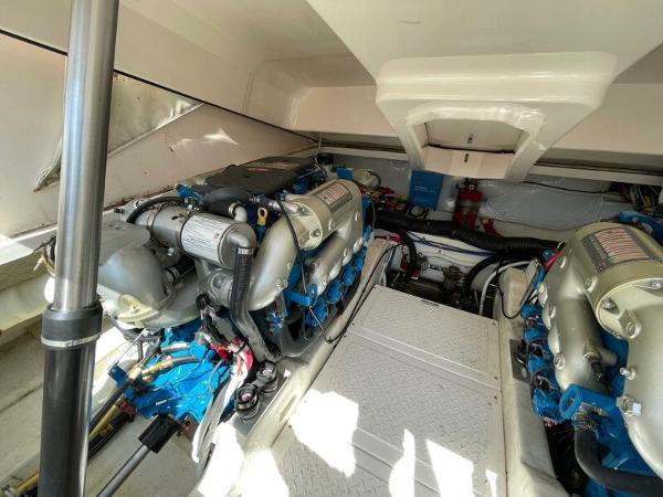 Slide: The Image of Engine compartment of 2012 Tiara Yachts 3100 Coronet, showcasing dual engines and mechanical components. - 21