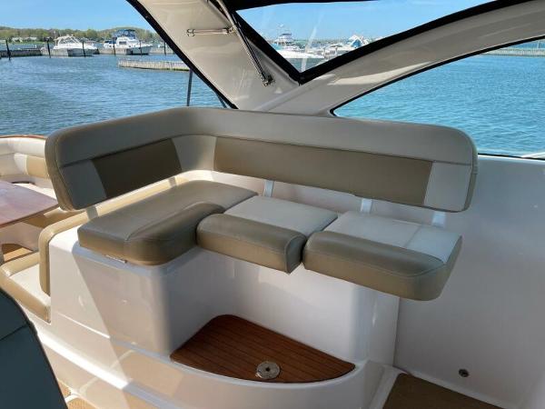 Slide: The Image of 2012 Tiara Yachts 3100 Coronet interior seating with ocean view in the background. - 8