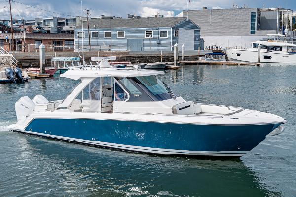 Slide: The Image of 2024 Tiara Yachts 34LS in a marina, side view. - 0