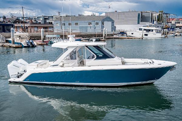 Slide: The Image of 2024 Tiara Yachts 34LS in marina, side view. - 1