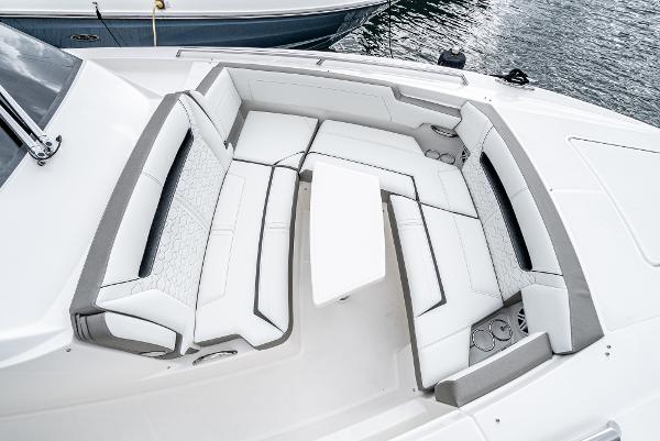 Slide: The Image of 2024 Tiara Yachts 34LS luxury boat seating area with white and gray upholstery. - 11
