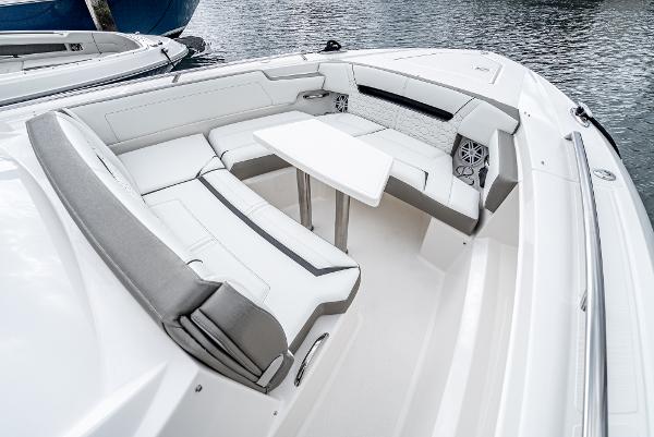 Slide: The Image of 2024 Tiara Yachts 34LS boat with luxurious seating and table on the deck. - 12