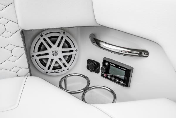 Slide: The Image of 2024 Tiara Yachts 34LS interior speaker and control panel with cup holders. - 13