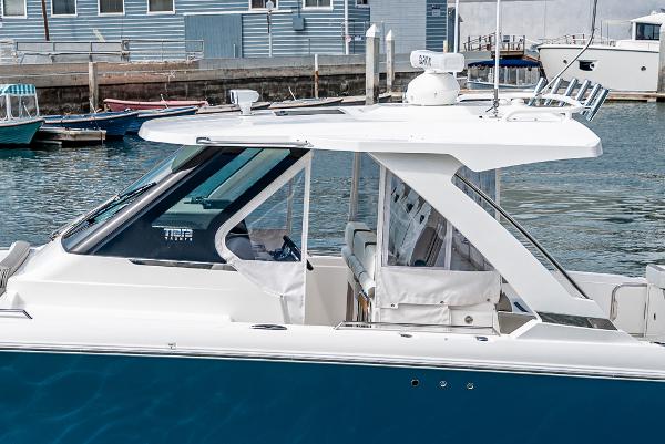 Slide: The Image of 2024 Tiara Yachts 34LS docked, showcasing sleek design and modern features. - 15