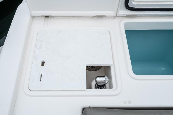 Slide: The Image of 2024 Tiara Yachts 34LS sink and cutting board area. - 23