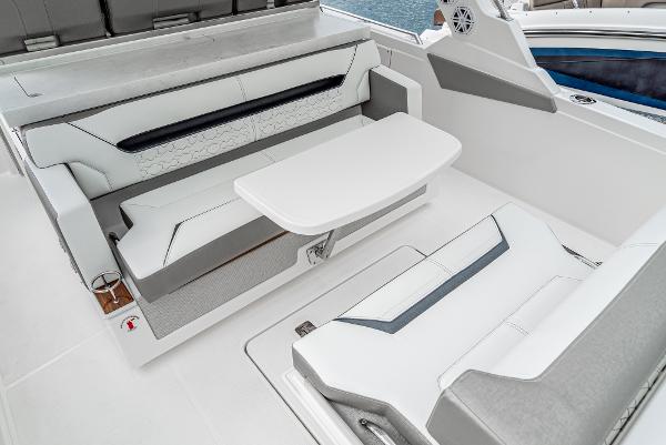 Slide: The Image of 2024 Tiara Yachts 34LS seating area with table and cushioned benches - 28