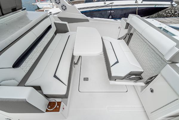 Slide: The Image of 2024 Tiara Yachts 34LS interior seating area with table. - 29