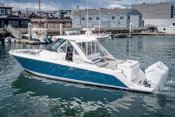 Slide: The Image of 2024 Tiara Yachts 34LS in a marina, side view. - 3