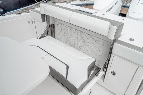 Slide: The Image of 2024 Tiara Yachts 34LS luxury seating area with white upholstery. - 30
