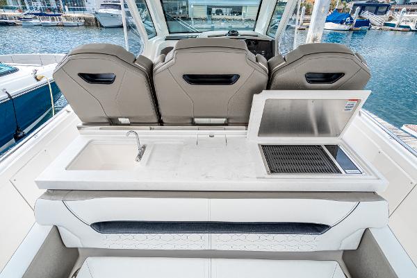 Slide: The Image of 2024 Tiara Yachts 34LS boat interior with sink and grill station. - 33