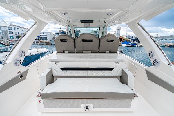 Slide: The Image of 2024 Tiara Yachts 34LS luxury boat interior with seating and waterfront view. - 36