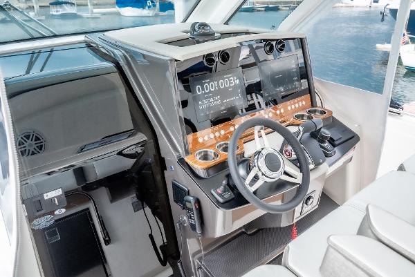 Slide: The Image of 2024 Tiara Yachts 34LS helm station with modern navigation displays and controls. - 39