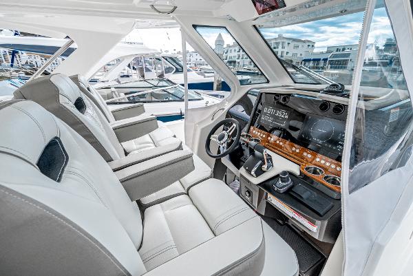 Slide: The Image of 2024 Tiara Yachts 34LS interior cockpit with modern navigation system and luxurious seating. - 42