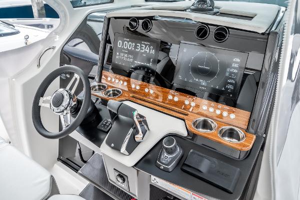 Slide: The Image of 2024 Tiara Yachts 34LS helm with advanced navigation displays and controls. - 43