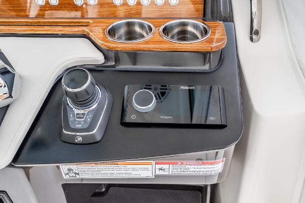 Slide: The Image of Control panel of 2024 Tiara Yachts 34LS with joystick and Fusion audio system. - 44