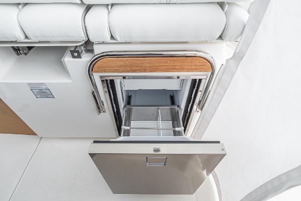 Slide: The Image of 2024 Tiara Yachts 34LS interior storage compartment with open drawer. - 47