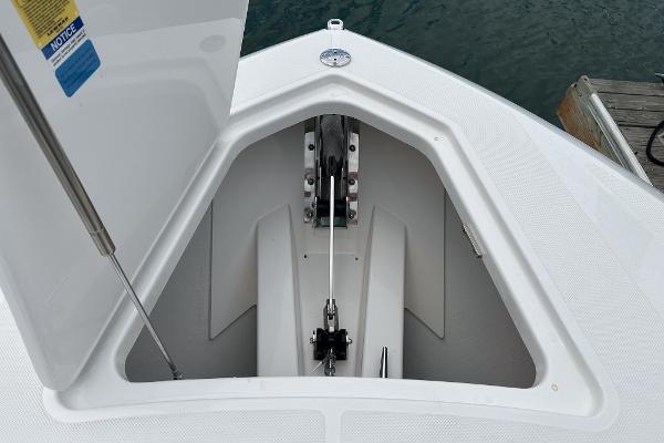 Slide: The Image of Anchor compartment of 2024 Tiara Yachts 34LS, open hatch, dockside view. - 7