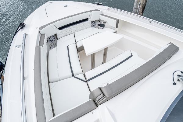 Slide: The Image of 2024 Tiara Yachts 34LS boat with spacious seating and table in the bow area. - 8