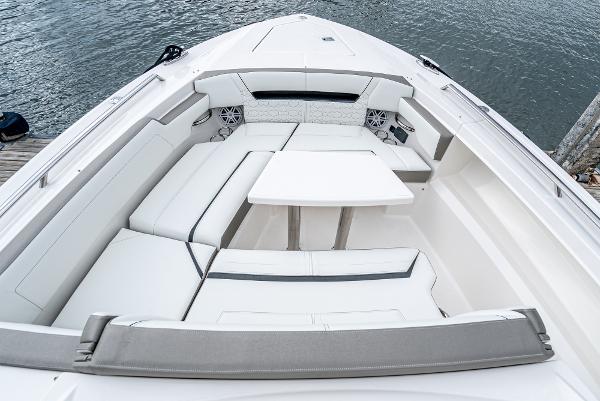 Slide: The Image of 2024 Tiara Yachts 34LS boat with spacious seating and table on the deck. - 9