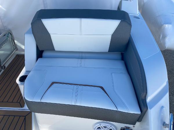 Slide: The Image of 2021 Tiara Yachts 34 LX seat with white and gray upholstery, featuring modern design. - 13