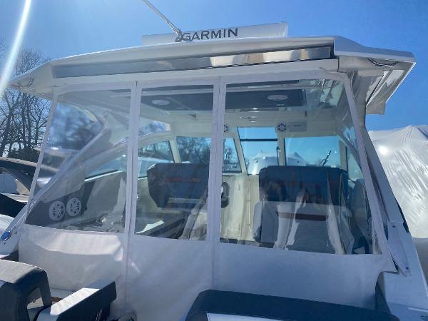 Slide: The Image of 2021 Tiara Yachts 34 LX with Garmin navigation, featuring sleek design and spacious interior. - 14