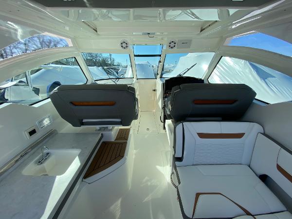 Slide: The Image of 2021 Tiara Yachts 34 LX interior with modern seating and sleek design. - 18