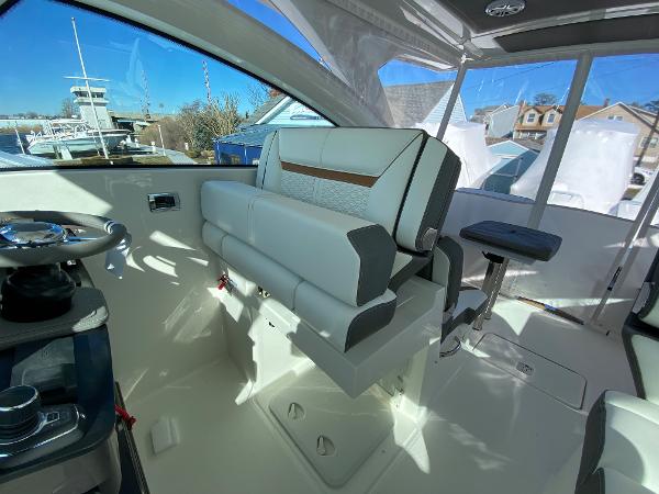 Slide: The Image of 2021 Tiara Yachts 34 LX interior with helm seating and modern design. - 22