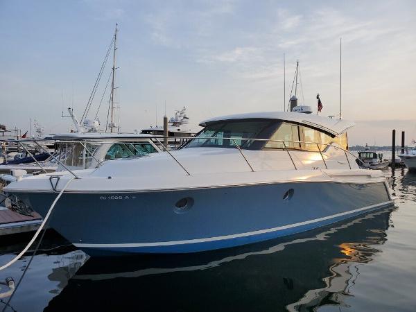 Slide: The Image of 2018 Tiara Yachts 39 docked at marina during sunset. - 2