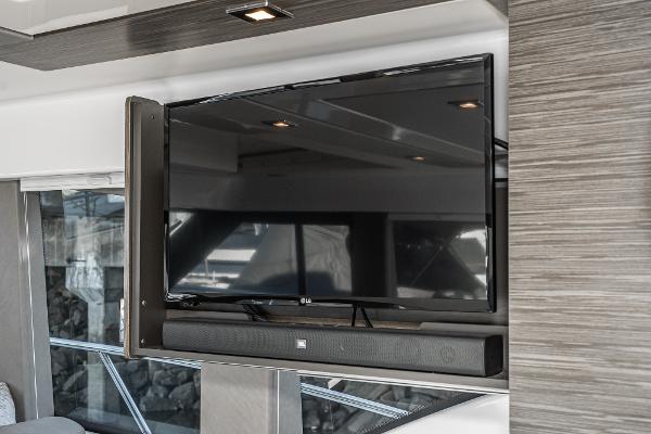 Slide: The Image of 2020 Tiara Yachts 39 Coupe interior with mounted TV and soundbar. - 12