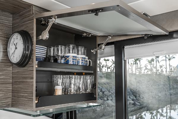 Slide: The Image of Open cabinet with glassware and dishes in 2020 Tiara Yachts 39 Coupe interior. - 13