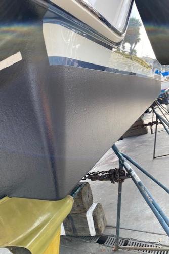 Slide: The Image of 2020 Tiara Yachts 39 Coupe hull on dry dock, showcasing sleek design and craftsmanship. - 14