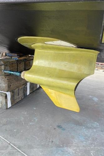 Slide: The Image of 2020 Tiara Yachts 39 Coupe propeller and rudder detail in dry dock. - 16