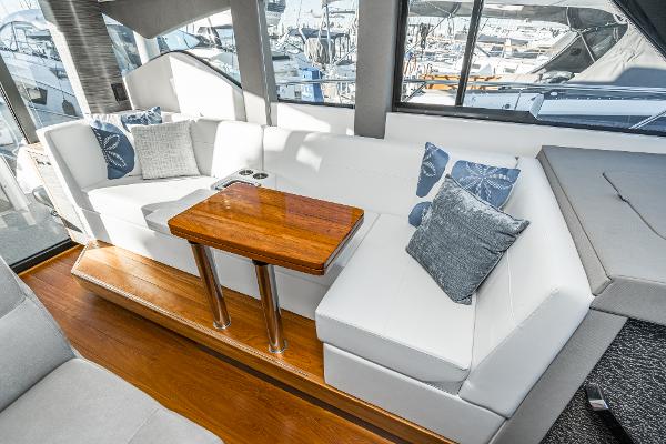 Slide: The Image of Luxurious interior of 2020 Tiara Yachts 39 Coupe with elegant seating and wooden table. - 17