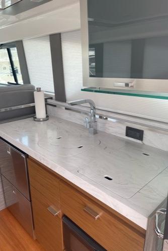 Slide: The Image of Modern kitchen interior of 2020 Tiara Yachts 39 Coupe with sleek countertops. - 19