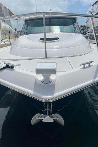 Slide: The Image of 2020 Tiara Yachts 39 Coupe, sleek white design, docked in marina. - 23