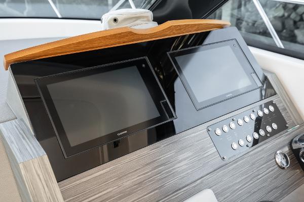 Slide: The Image of Dashboard of 2020 Tiara Yachts 39 Coupe with dual screens and control panel. - 23