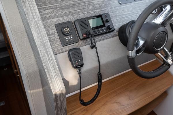 Slide: The Image of Control panel of 2020 Tiara Yachts 39 Coupe with steering wheel and communication devices. - 25